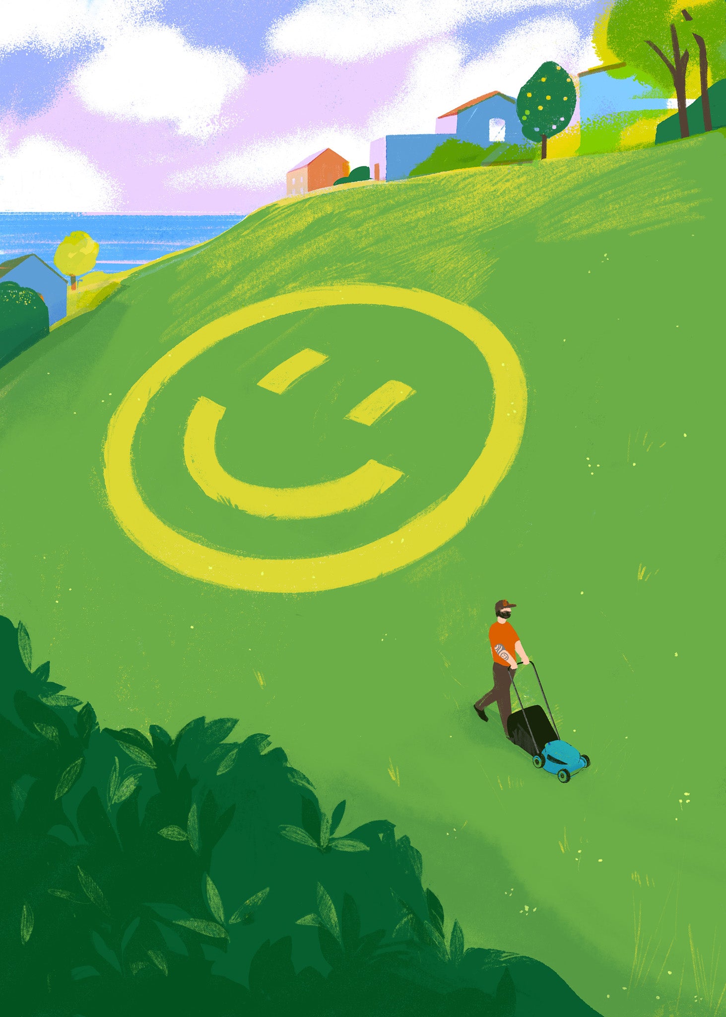 Person mowing a lawn with a large smiley face design on a green hillside.