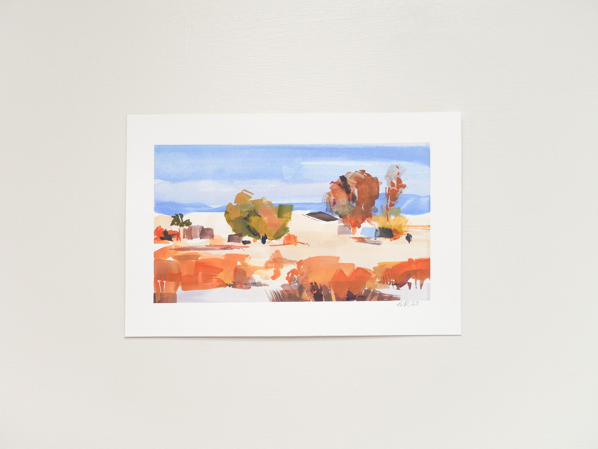 Original gouache painting on archival hot press paper. An abstracted desert landscape with saturated orange-reds and a clear blue sky. 